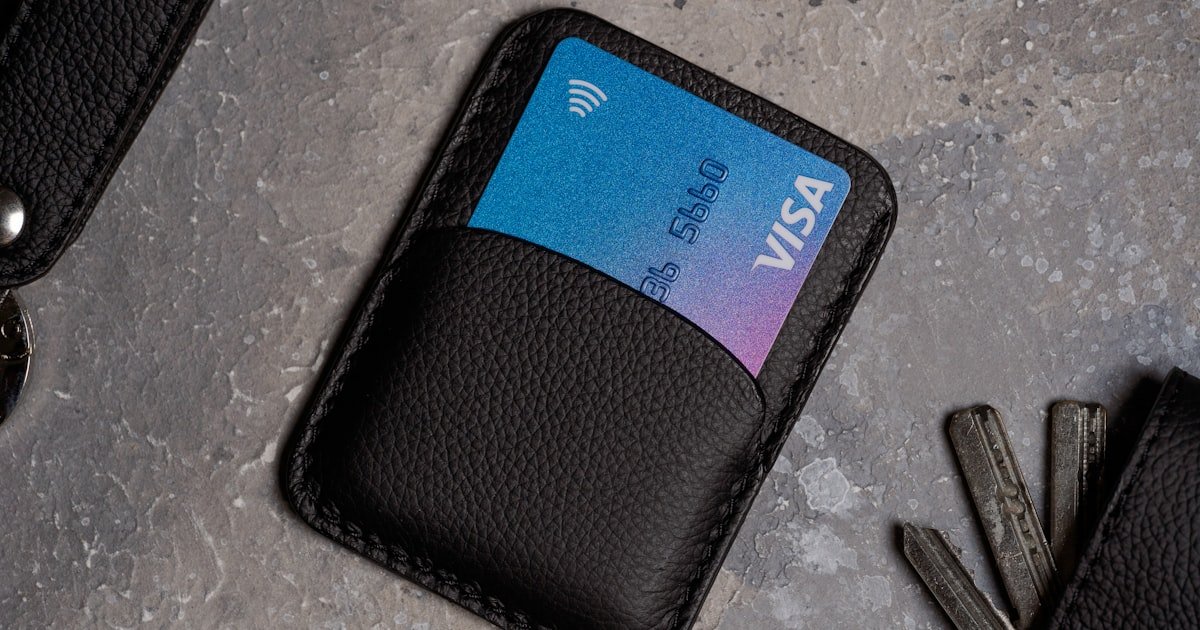 Photo representing a credit card being cut or closed