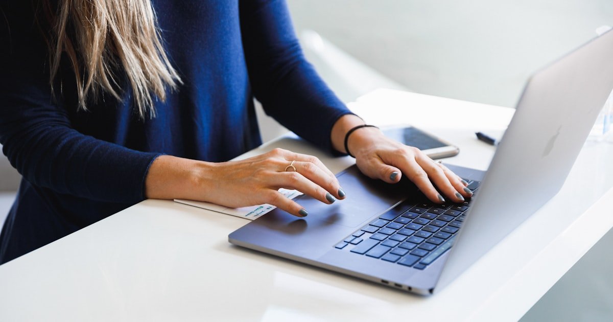 Photo representing online banking on a laptop and phone